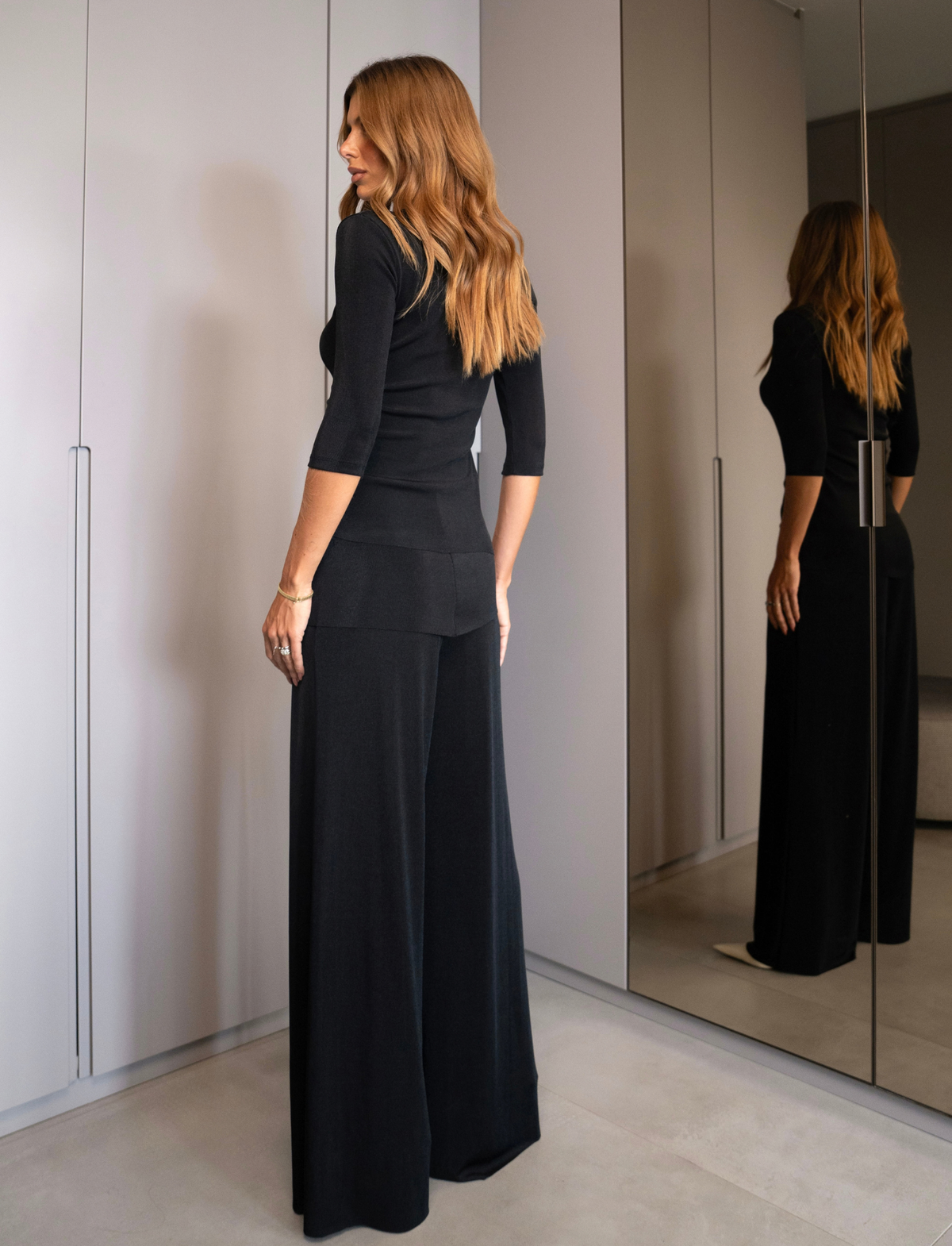 Conjunto em Malha Calça Pantalona com Saia Sobreposta